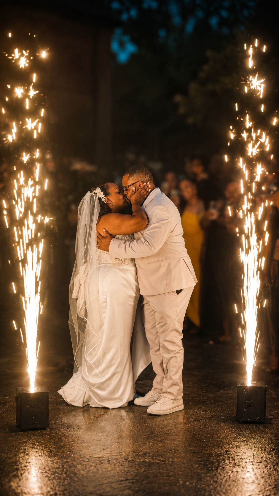 Send-off kiss framed by cold-spark fountains — Weddings by Good Time Mascots in Columbus, Ohio