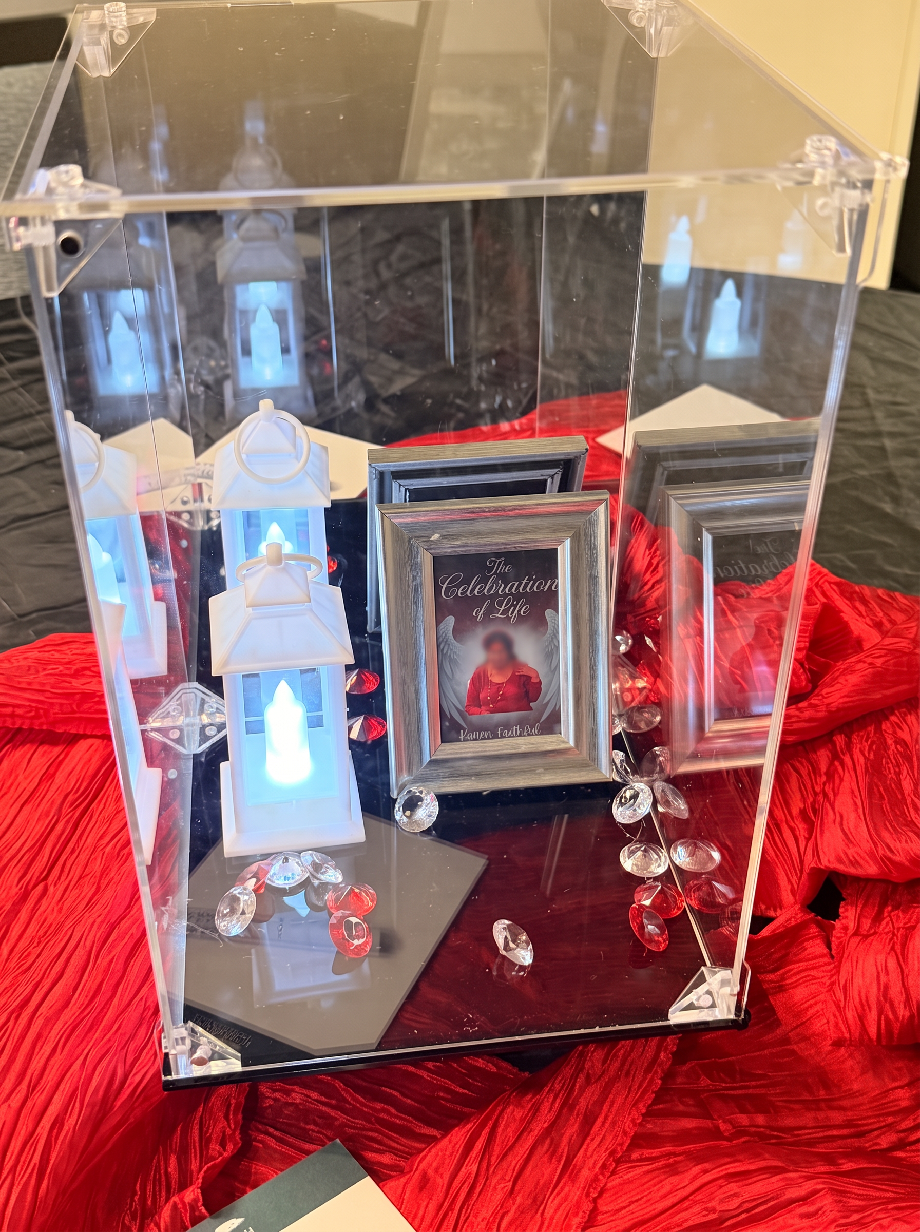 Keepsake memorial box with glowing lanterns, framed tribute portrait and gemstones — Celebration of Life & Memorials by Good Time Mascots in Columbus, Ohio
