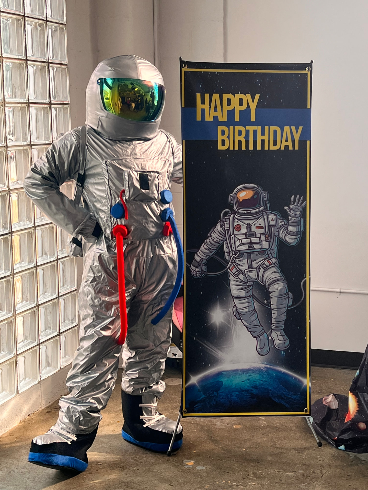 Astronaut-themed birthday with a space banner and backdrop — Guest Experience Enhancements by Good Time Mascots in Columbus, Ohio